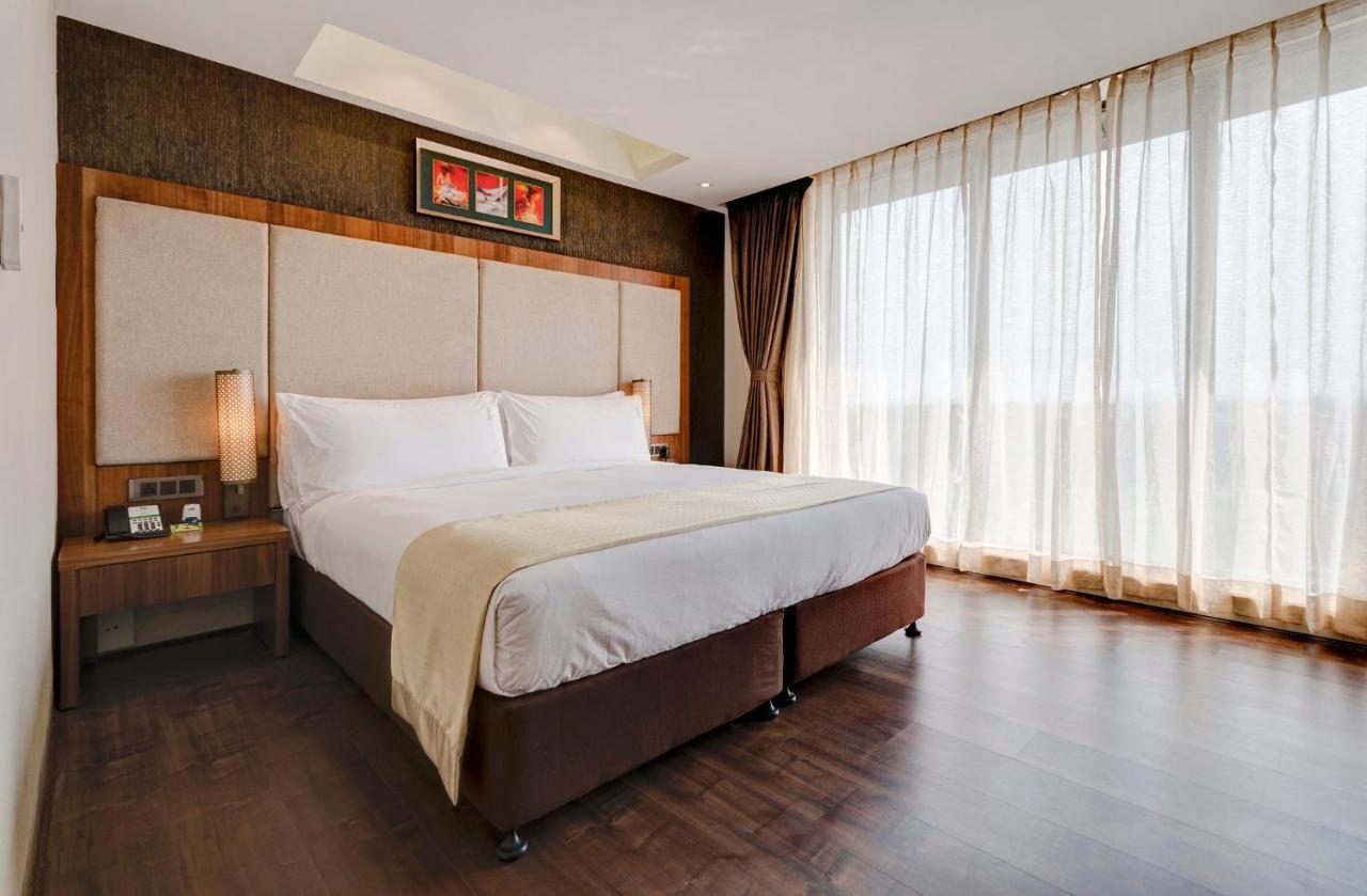 Holiday Inn Kolkata Airport By Ihg Eksteriør billede A bedroom at the hotel